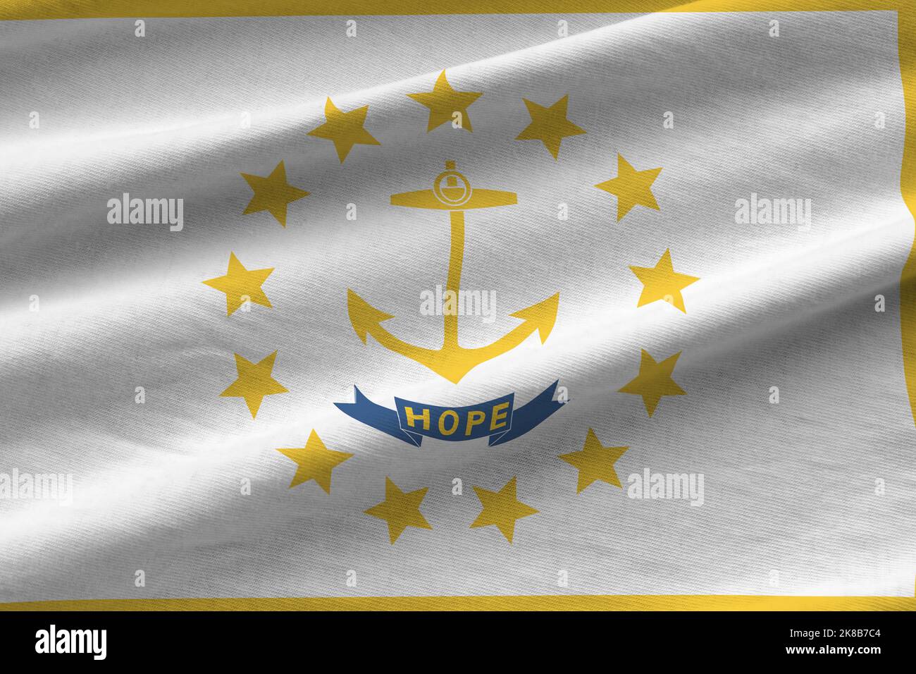 Rhode Island US state flag with big folds waving close up under the studio light indoors. The official symbols and colors in fabric banner Stock Photo