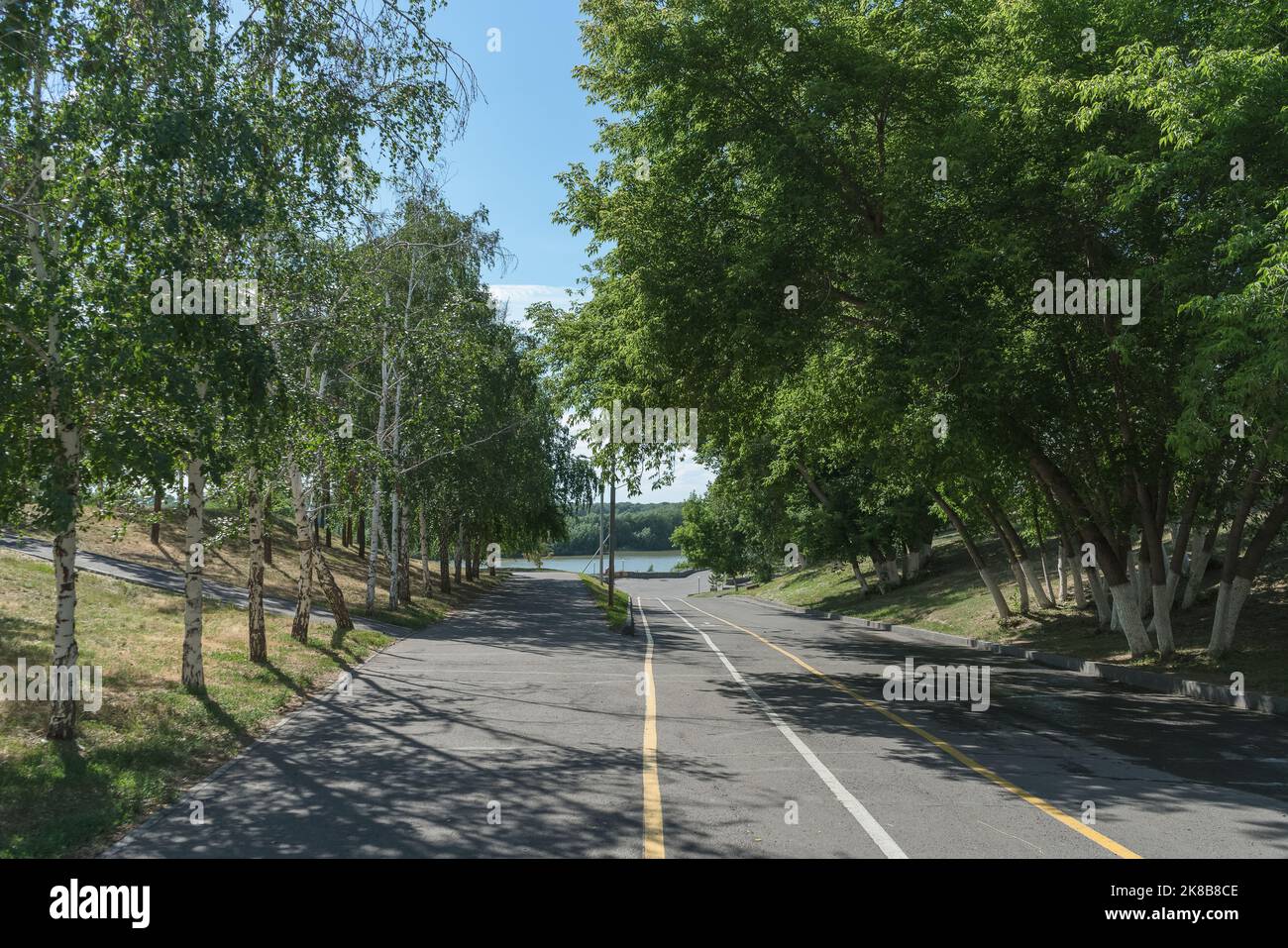 road down to the beach in Pavlodar on sunny summer day Stock Photo