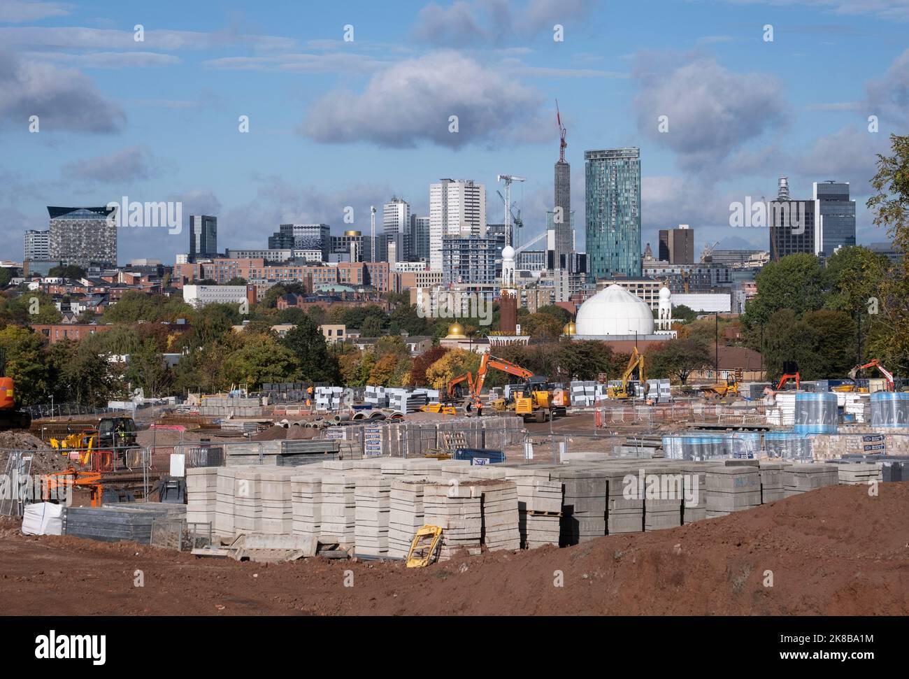 A view of the Birmingham City Centre skyline, England with tower block offices, construction site and cranes along with the Birmingham Central Mosque. Stock Photo