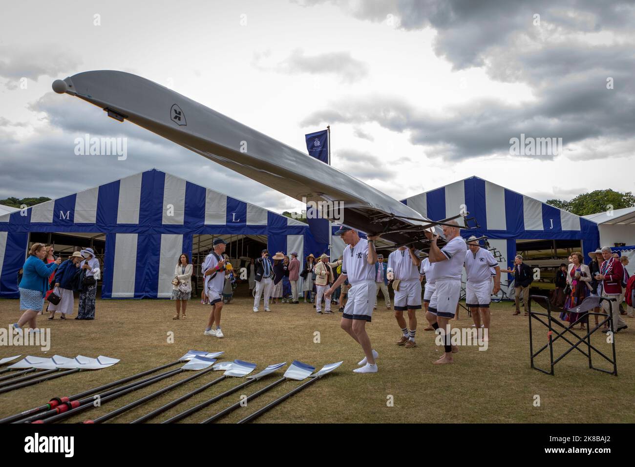 Henley Royal Regatta, an annual rowing event, takes place on the River Thames.   Pictured: Rowers position their boat next to the dock before their go Stock Photo