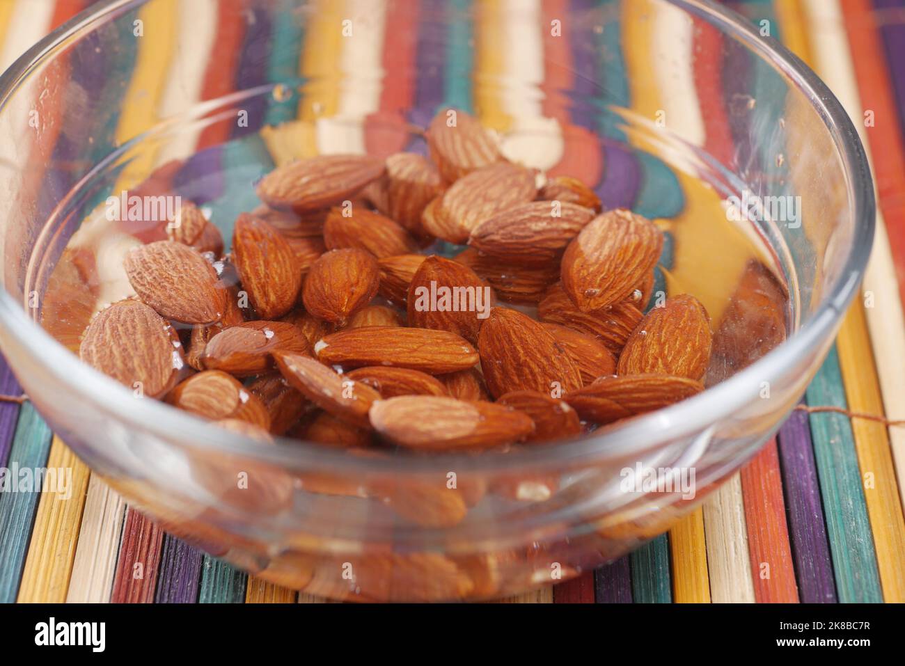 Close up of almond nuts in water in a bowl  Stock Photo