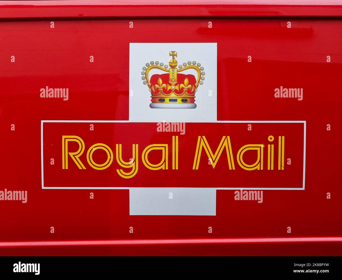 Exeter, UK - October 2022: The logo of Royal Mail (International Distributions Services plc), on the side of one of their iconic red delivery vans Stock Photo