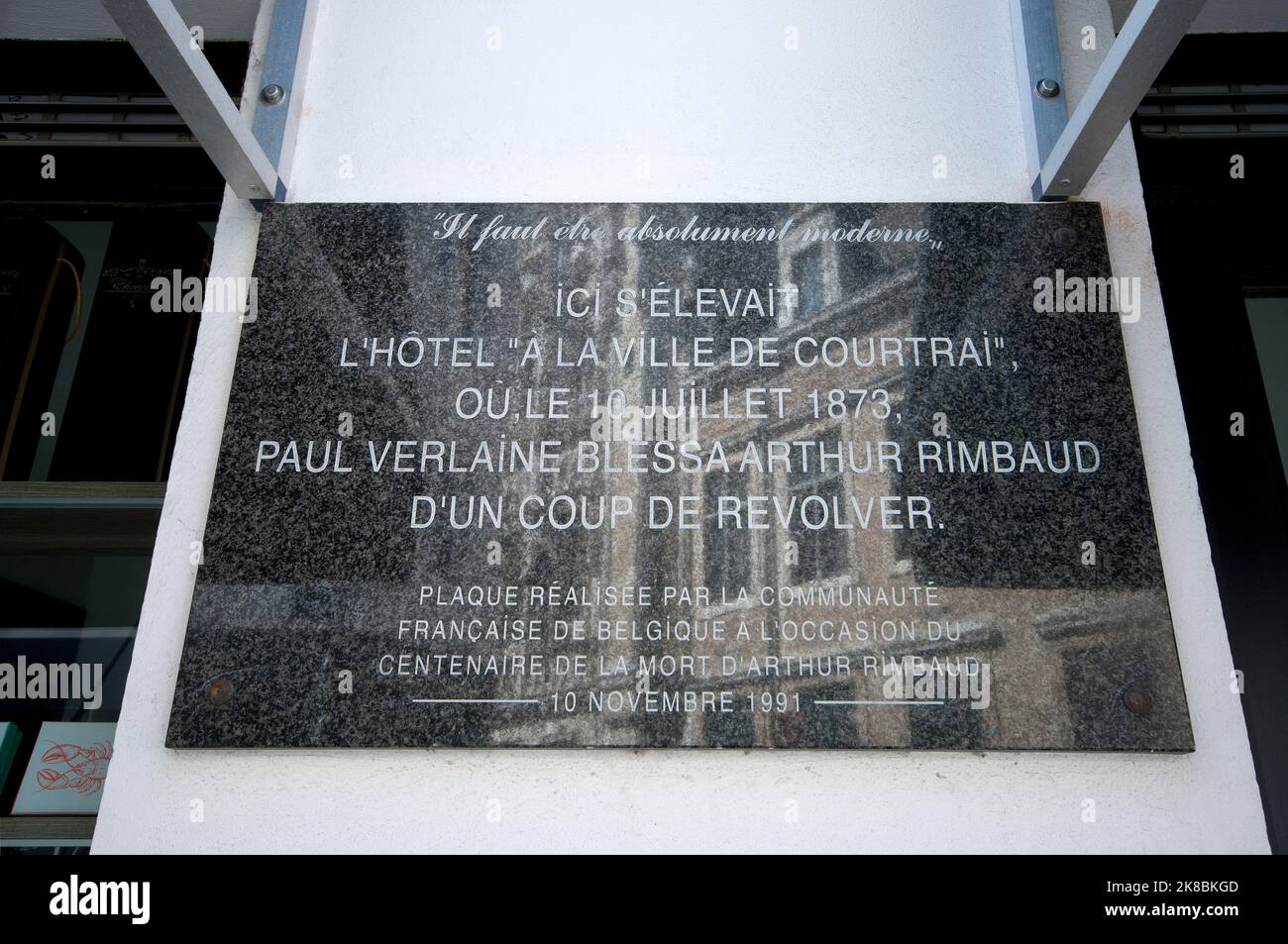 Commemorative plaque (1991) in Rue des Brasseurs 1, where the French poet Paul Verlaine wounded Arthur Rimbaud with a gun in 1873, Brussels, Belgium Stock Photo