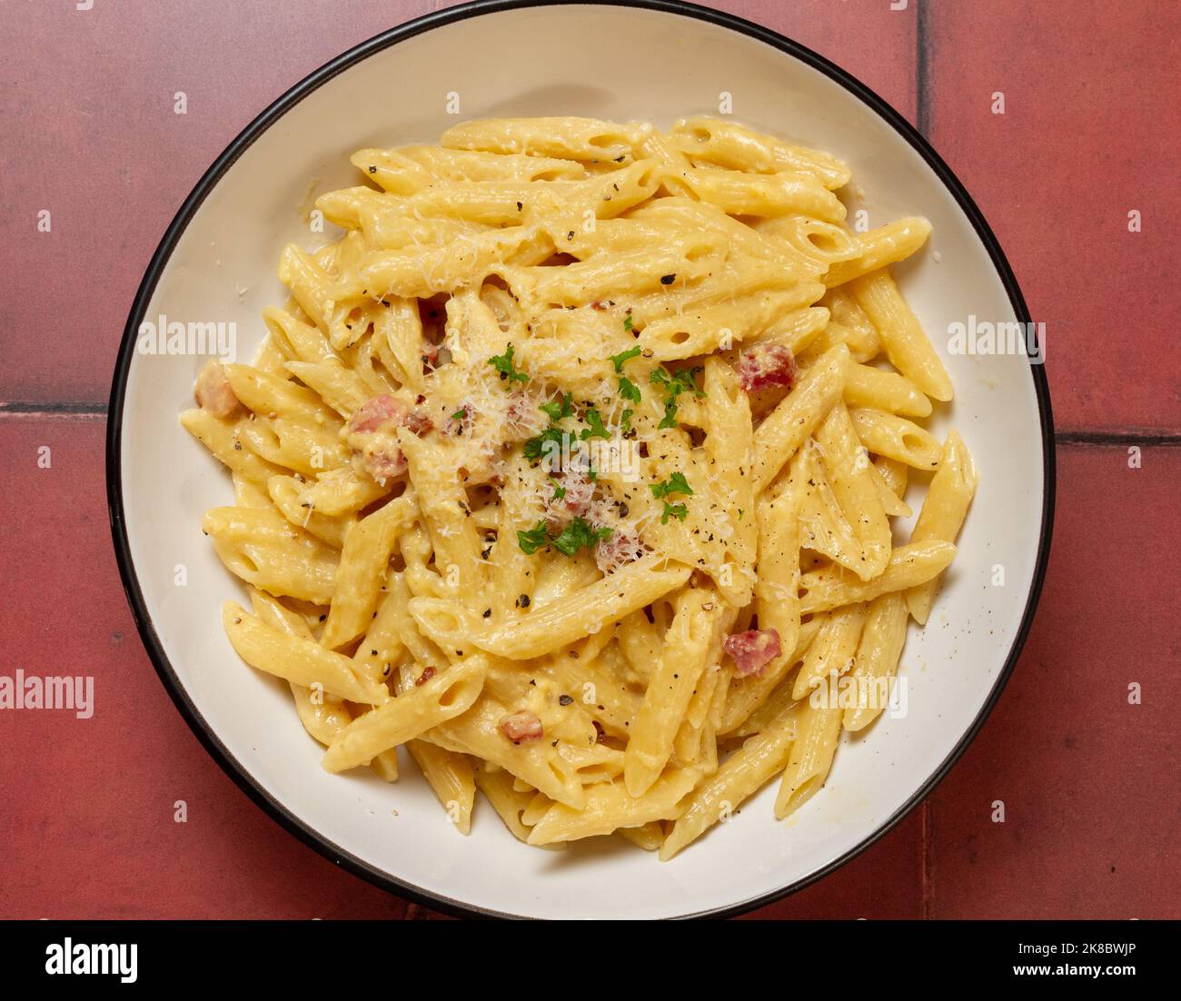 Penne carbonara from above Stock Photo