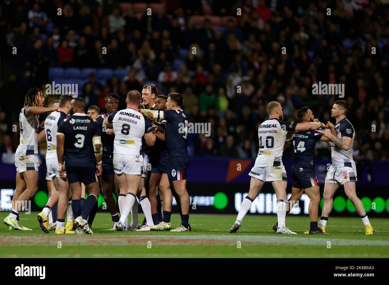 Players from both sides clash during the Rugby League World Cup group A