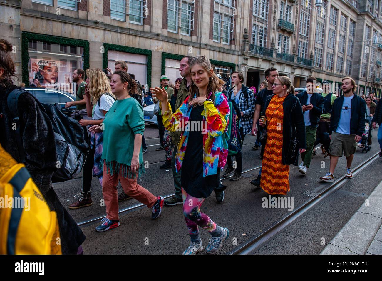 People are seen dancing behind one of the trucks with sound system