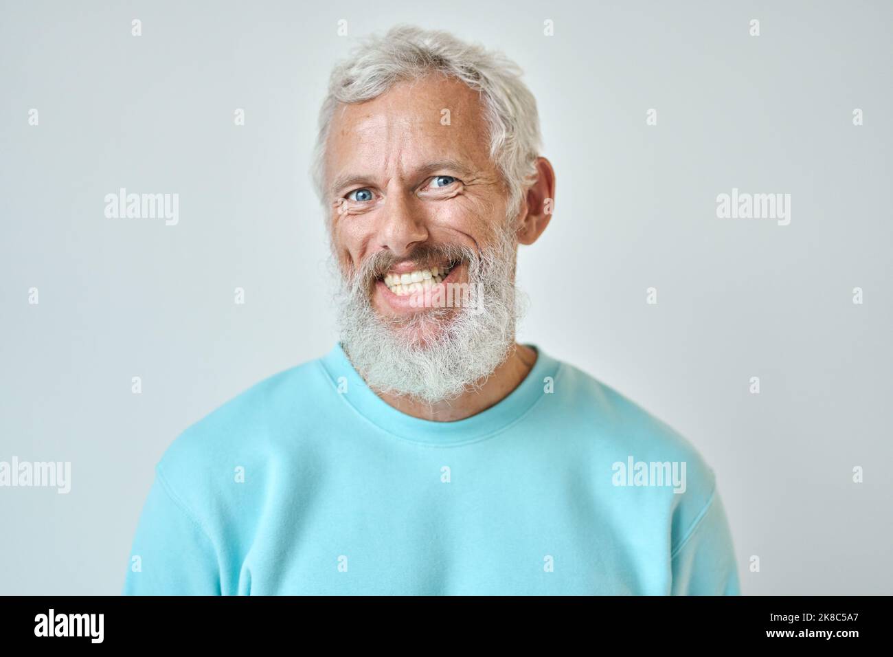 Smiling old bearded man isolated on white background, headshot portrait. Stock Photo
