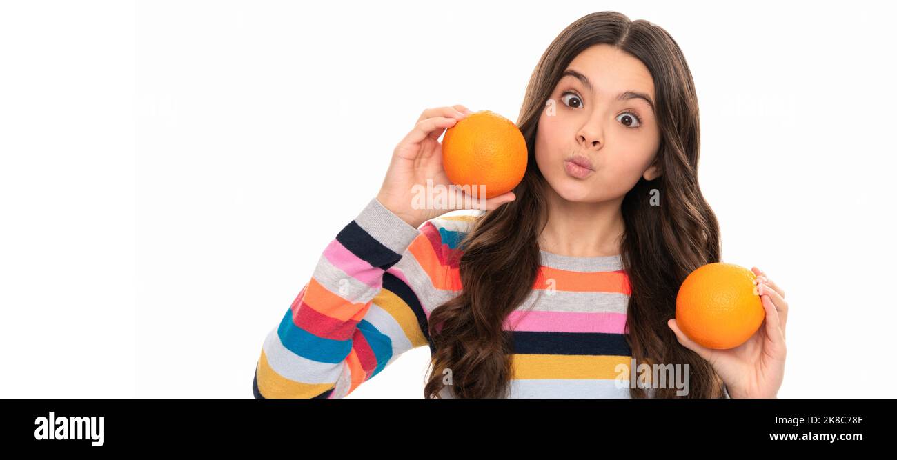 funny child eating healthy food. childhood health. citrus fruits. natural organic fresh orange. Child girl portrait with orange, horizontal poster Stock Photo