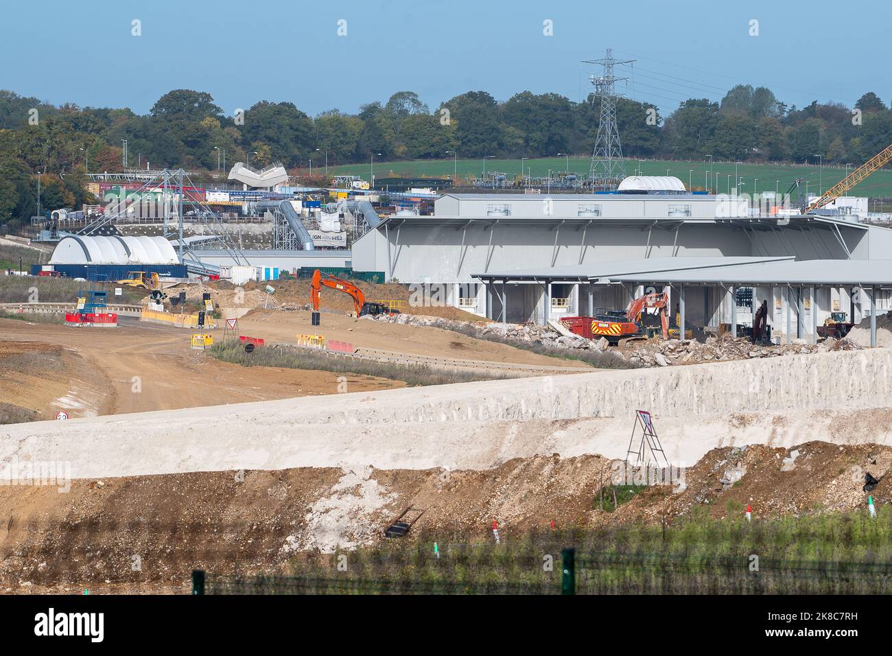 West Hyde, UK. 22nd October, 2022. The HS2 South Portal Compound where the 10 mile Chiltern Tunnel is being bored underneath the Chilterns by two tunnel boring machines called Florence and Cecilia. Concrete for building the railway viaducts is manufactured at the site as are the concrete wall tunnel segments. Phase 1 of the HS2 project is reported to be vastly over budget and the Treasury  have asked for a financial review to take place. Environmentalists are continuing their fight to get HS2 to be cancelled. Credit: Maureen McLean/Alamy Live News Stock Photo