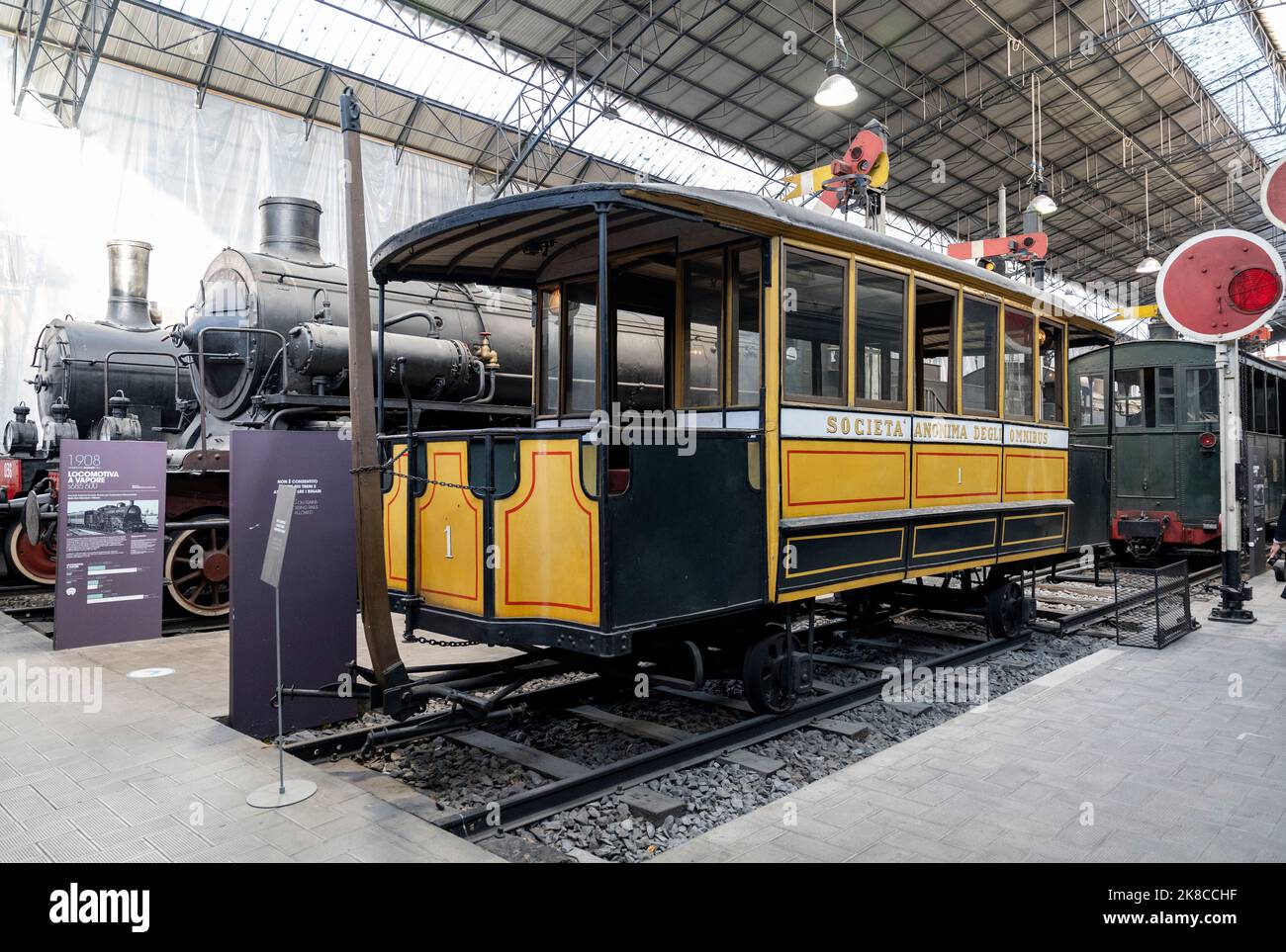 Transport section with omnibus, locomotives and trains in National Museum of Science and Technology, Milan city center, Lombardy region, Italy Stock Photo