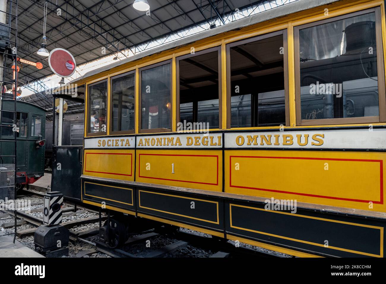 Transport section with omnibus, locomotives and trains in National Museum of Science and Technology, Milan city center, Lombardy region, Italy Stock Photo