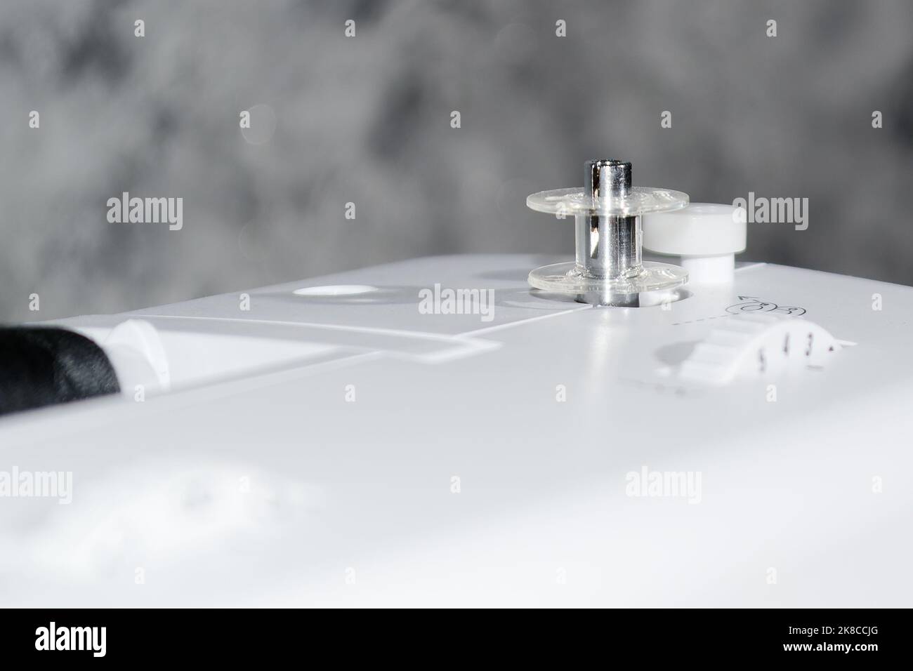 Sewing machine. Bobbin on a sewing machine. Close-up. Stock Photo