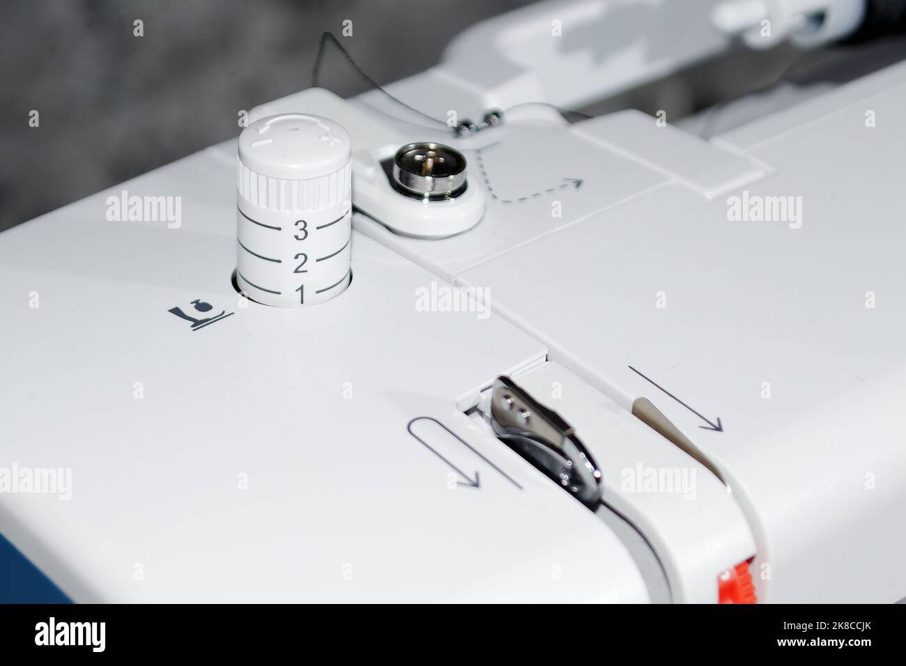 Sewing machine. Presser foot pressure regulator. Closeup Stock Photo