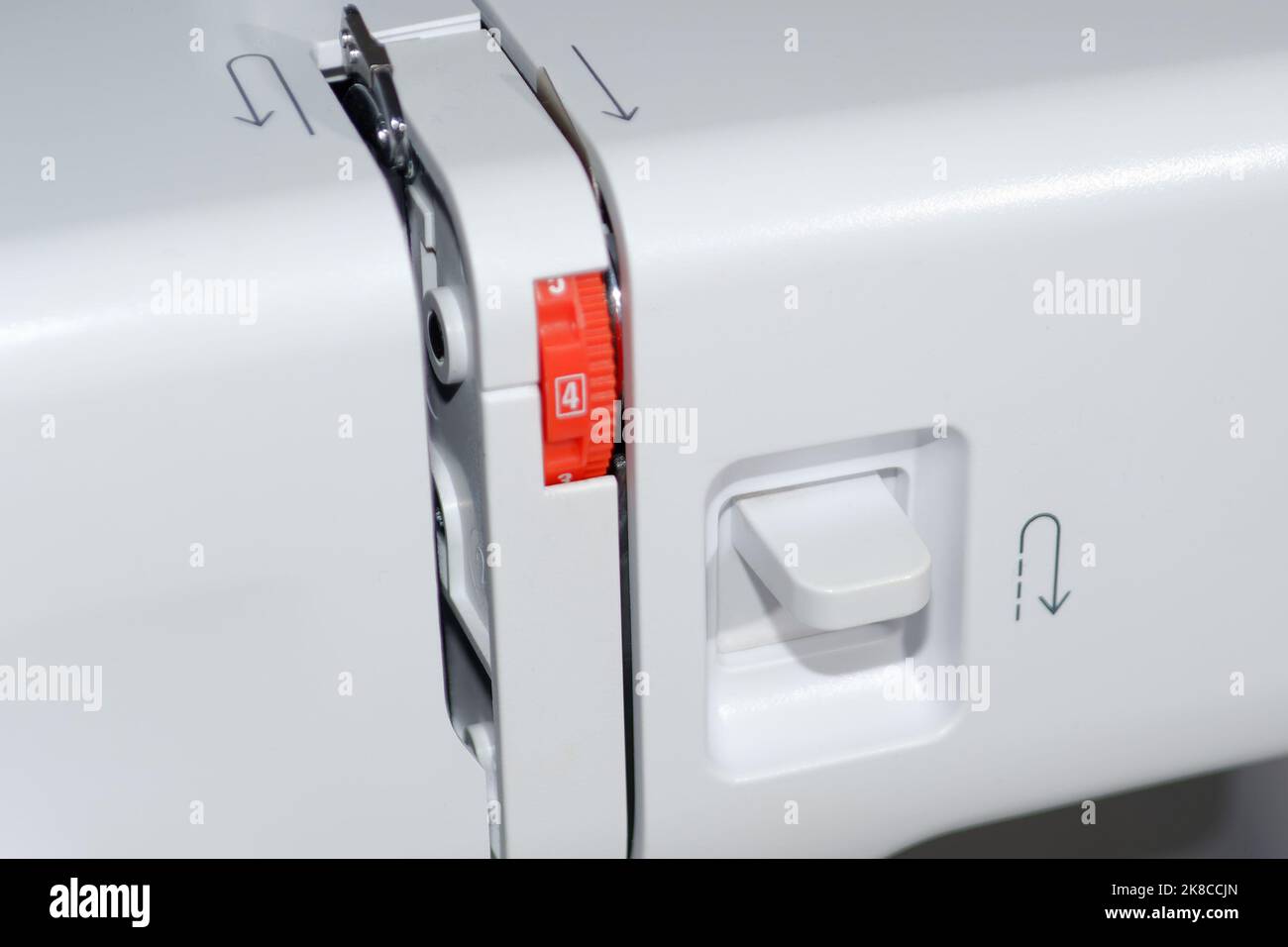 Sewing machine. Closeup reverse stitch button Stock Photo Alamy