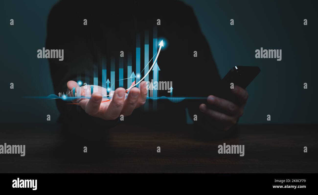 Stock market, Business growth, progress or success, planning and strategy concept, Businessman or trader is showing a growing virtual hologram stock, Stock Photo