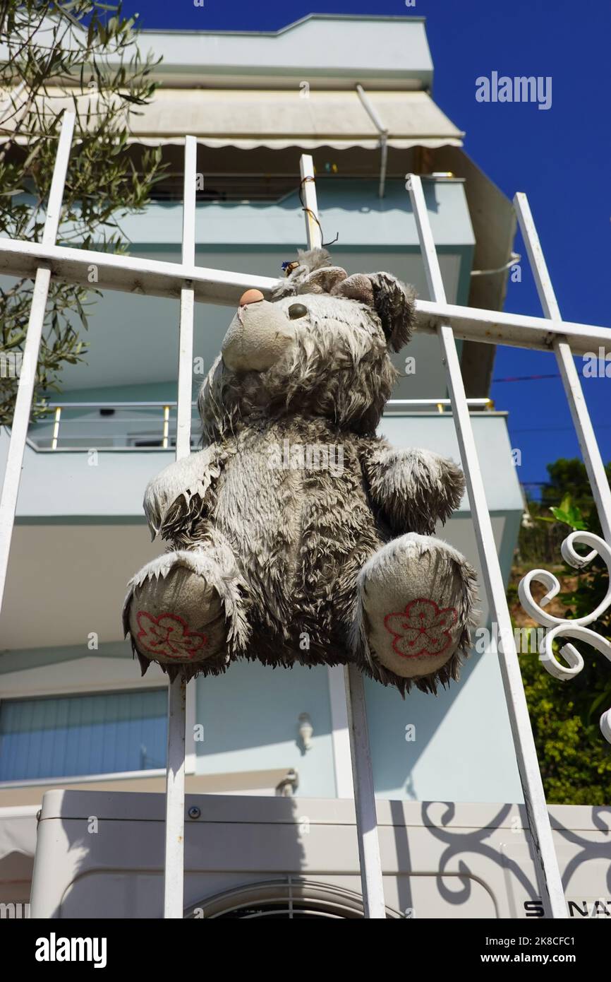 Stuffed animals are hung up in front of houses in Albania as protection against evil, Saranda, Republic of Albania Stock Photo
