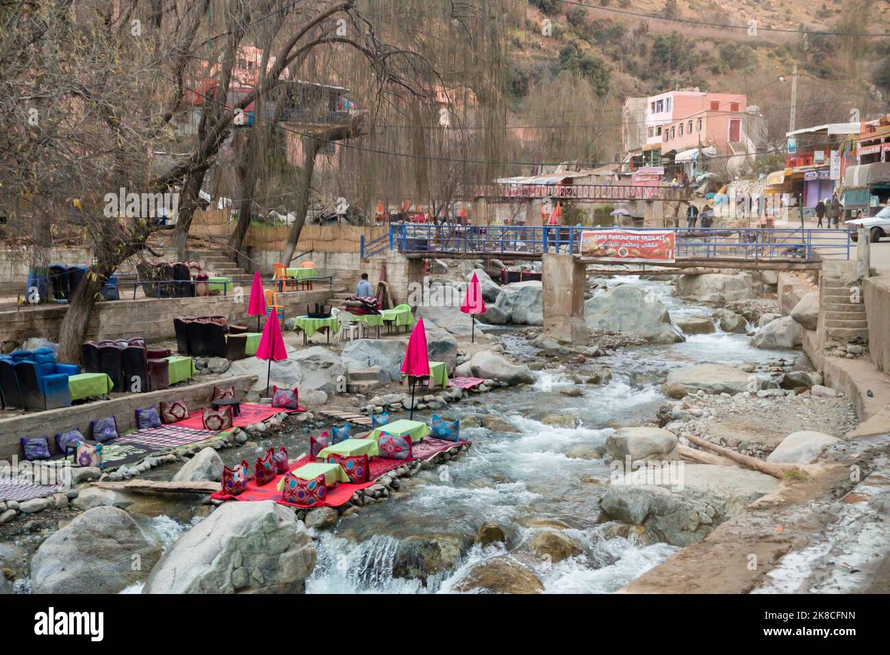 Colourful outdoor restaurants with tables in or overlooking the river in the small town of Setti Fatma, Ourika Valley, Morocco, North Africa Stock Photo