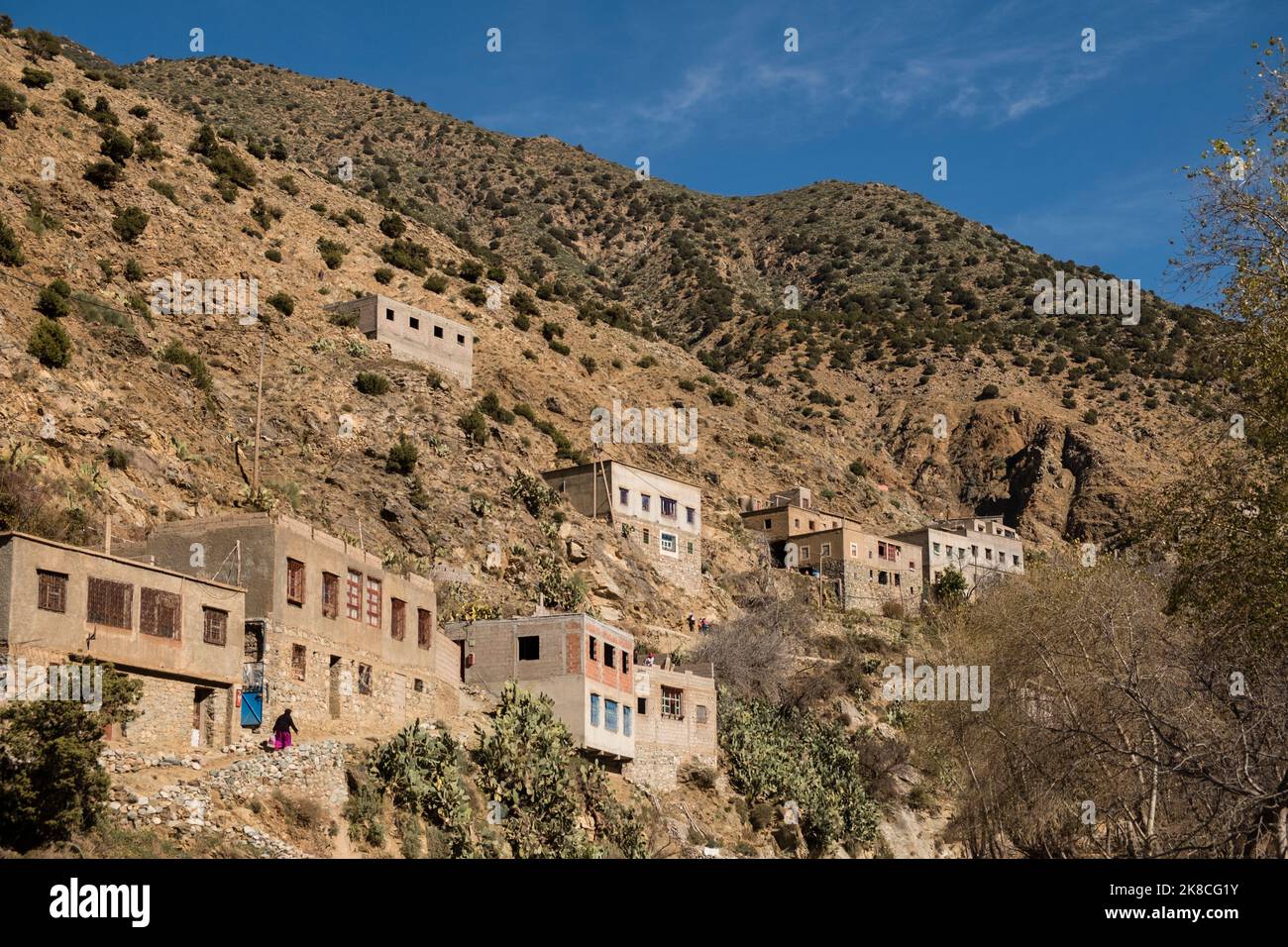 Small Berber village with homes nestled into the hillside, High Atlas Mountains, Ourika Valley, Morocco, North Africa Stock Photo