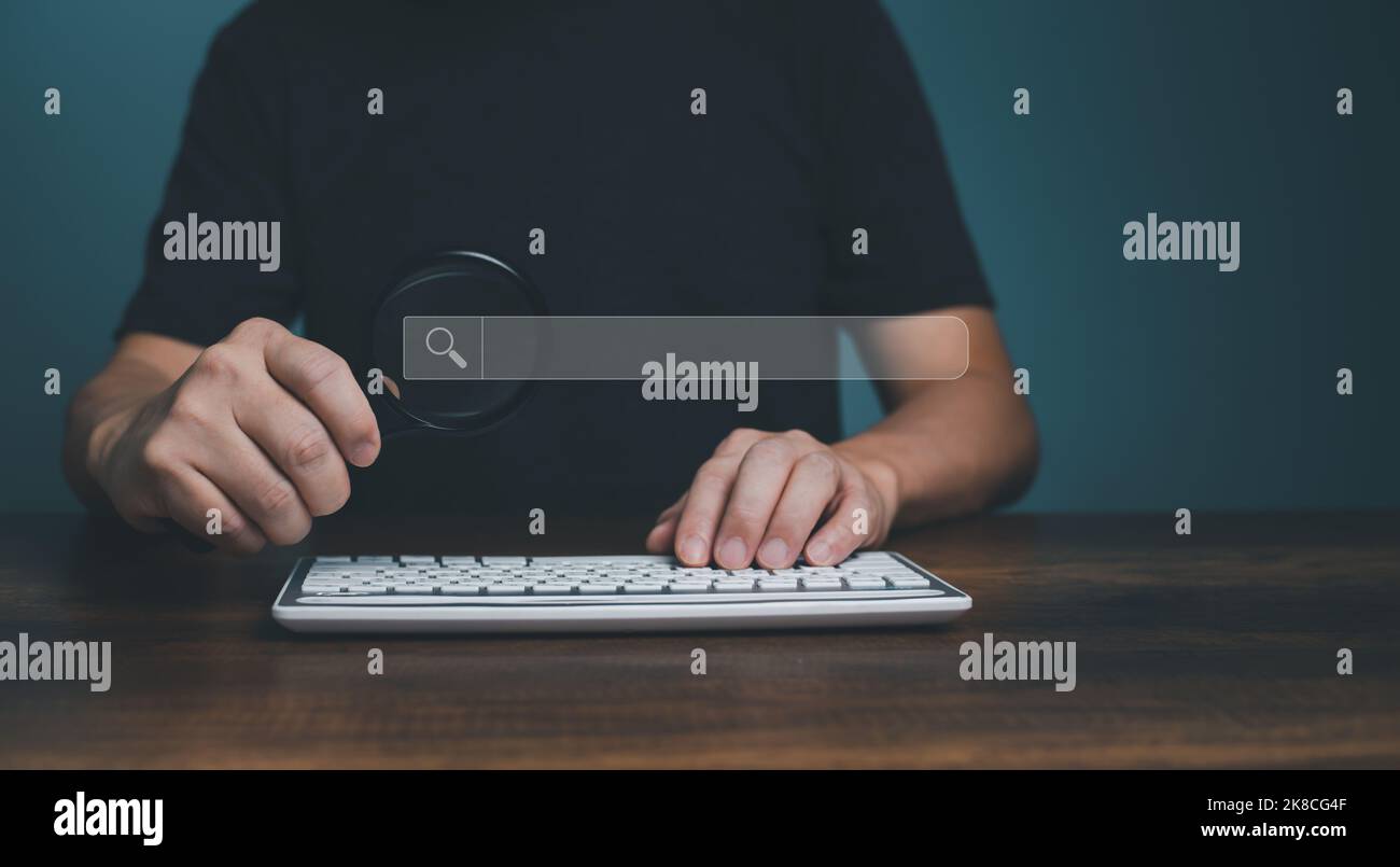Magnifying glass keyboard computer and search bar or search box on ...