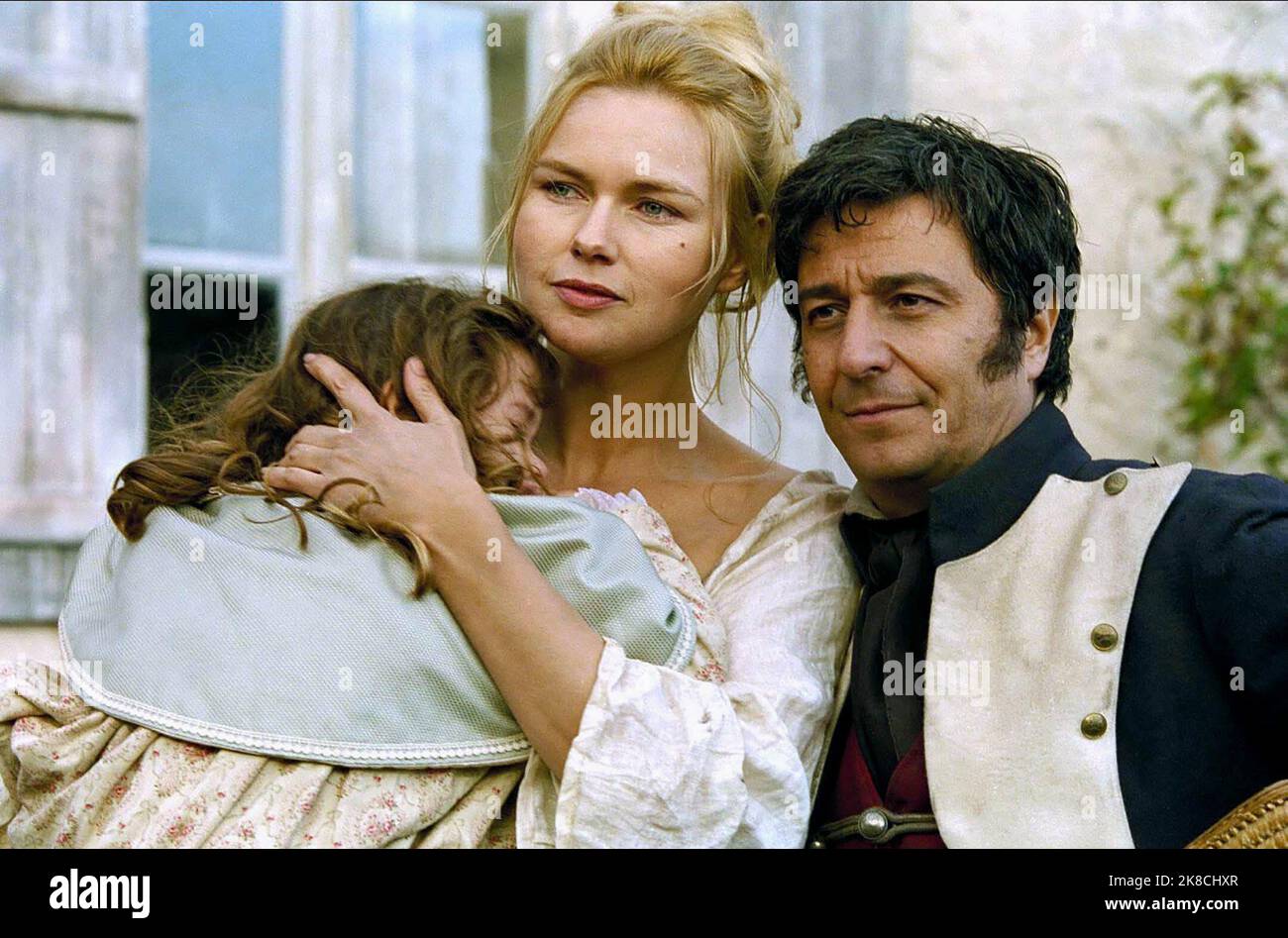 Leopoldine Serre, Veronica Ferres & Christian Clavier Television: Les Miserables (TV-Miniserie) Characters: Cosette enfant,Madame Thenardier & Thenardier  Fr/It/E/De/Usa 2000, / Literaturverfilmung (Based On The Book By Victor Hugo) Director: Josee Dayan 04 September 2000   **WARNING** This Photograph is for editorial use only and is the copyright of TAURUS FILMTF1 and/or the Photographer assigned by the Film or Production Company and can only be reproduced by publications in conjunction with the promotion of the above Film. A Mandatory Credit To TAURUS FILMTF1 is required. The Photographer Stock Photo