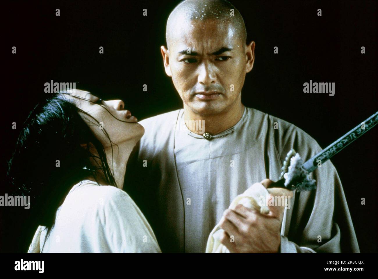 Zhang Ziyi & Chow Yun-Fat Film: Crouching Tiger, Hidden Dragon (Wo hu cang long)   Tw/Chn/Hk/Usa 2000, Director: Ang Lee 18 May 2000   **WARNING** This Photograph is for editorial use only and is the copyright of SONY PICTURES CLASSICS and/or the Photographer assigned by the Film or Production Company and can only be reproduced by publications in conjunction with the promotion of the above Film. A Mandatory Credit To SONY PICTURES CLASSICS is required. The Photographer should also be credited when known. No commercial use can be granted without written authority from the Film Company. Stock Photo