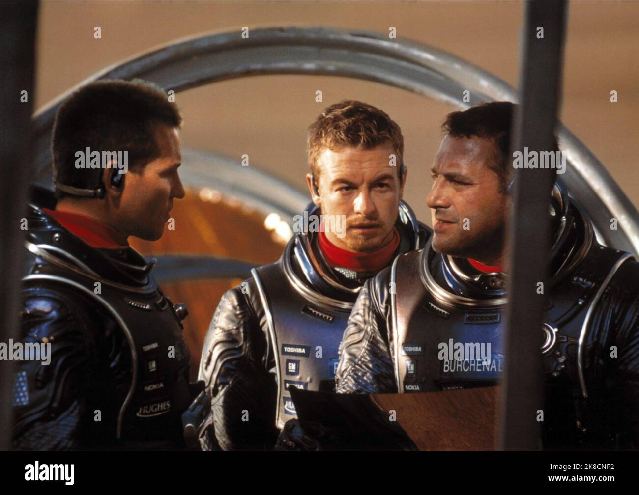 Val Kilmer, Simon Baker & Tom Sizemore Film: Red Planet (USA/AUS 2000) Characters: Robby Gallagher, Chip Pettengill, Dr. Quinn Burchenal  Director: Antony Hoffman 06 November 2000   **WARNING** This Photograph is for editorial use only and is the copyright of WARNER BROS. and/or the Photographer assigned by the Film or Production Company and can only be reproduced by publications in conjunction with the promotion of the above Film. A Mandatory Credit To WARNER BROS. is required. The Photographer should also be credited when known. No commercial use can be granted without written authority from Stock Photo