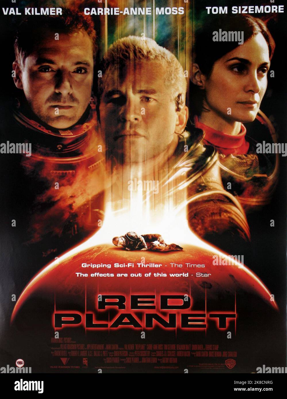 Tom Sizemore, Val Kilmer & Carrie-Anne Moss Poster Film: Red Planet (USA/AUS 2000) Characters: Dr. Quinn Burchenal,Robby Gallagher &  Director: Antony Hoffman 06 November 2000   **WARNING** This Photograph is for editorial use only and is the copyright of WARNER BROS. and/or the Photographer assigned by the Film or Production Company and can only be reproduced by publications in conjunction with the promotion of the above Film. A Mandatory Credit To WARNER BROS. is required. The Photographer should also be credited when known. No commercial use can be granted without written authority from the Stock Photo