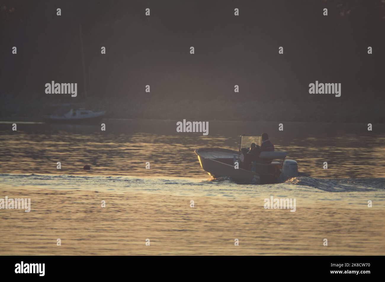 Man motorboat jetty hi-res stock photography and images - Alamy