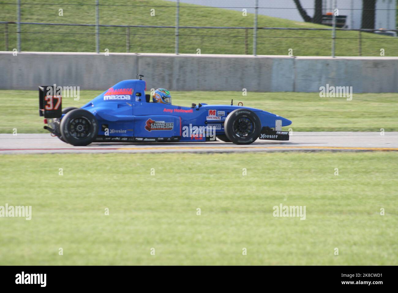 Coming out of 'Thunder Valley' of Road America Sports Car Course during the WeatherTech Chicago Region SCCA June Sprints 2022. Stock Photo