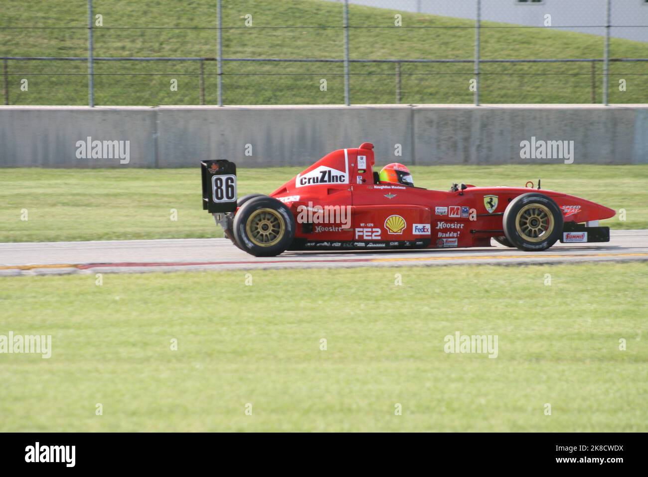 Coming out of 'Thunder Valley' of Road America Sports Car Course during the WeatherTech Chicago Region SCCA June Sprints 2022. Stock Photo