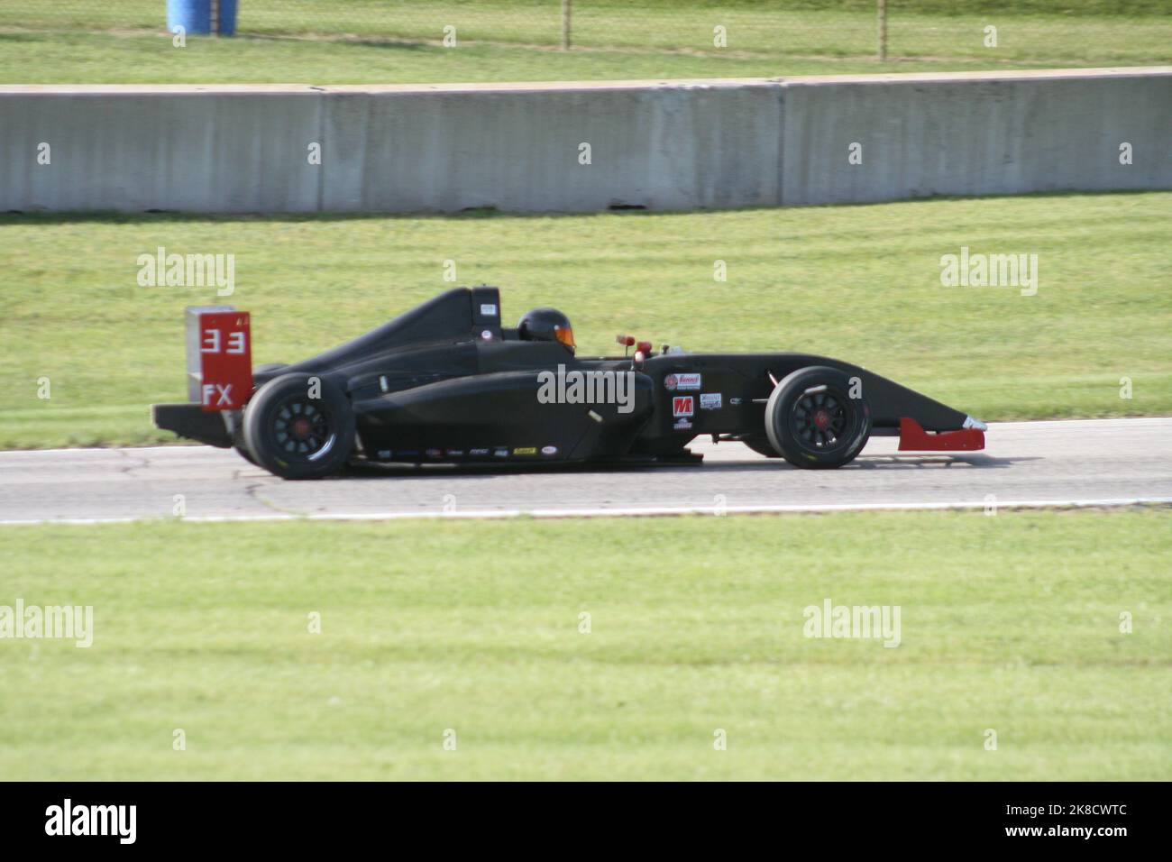 Coming out of 'Thunder Valley' of Road America Sports Car Course during the WeatherTech Chicago Region SCCA June Sprints 2022. Stock Photo
