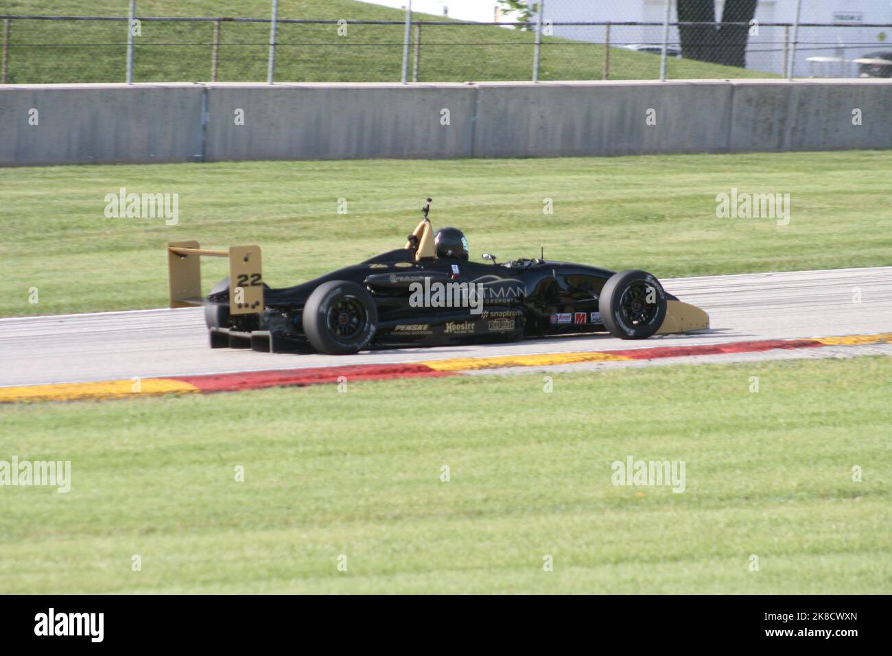 Coming out of 'Thunder Valley' of Road America Sports Car Course during the WeatherTech Chicago Region SCCA June Sprints 2022. Stock Photo