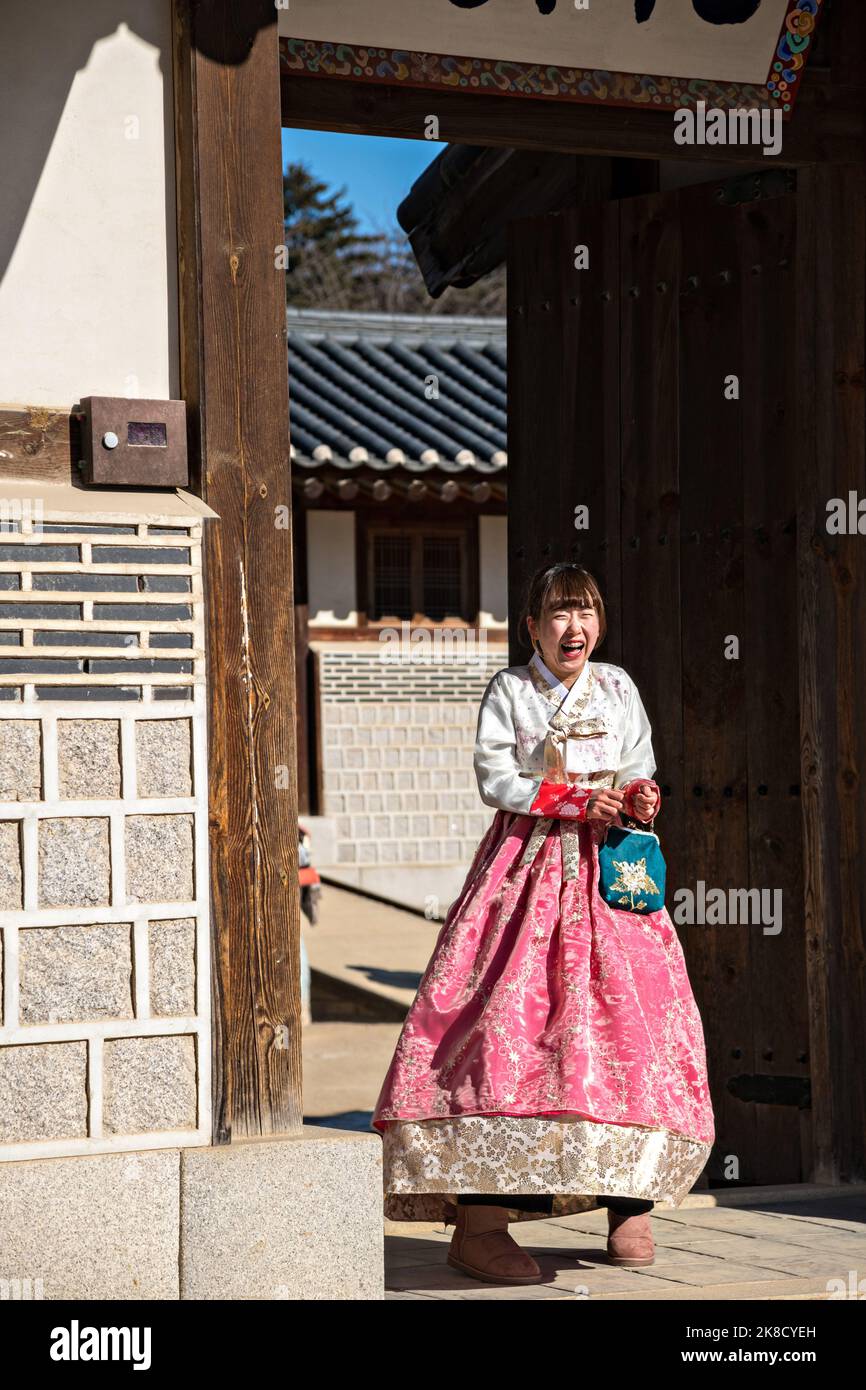 Chinese tourists, dressed in traditional Korean costumes a winter day at the Gyeongbokgung Palace in Seoul, South Korea. Stock Photo