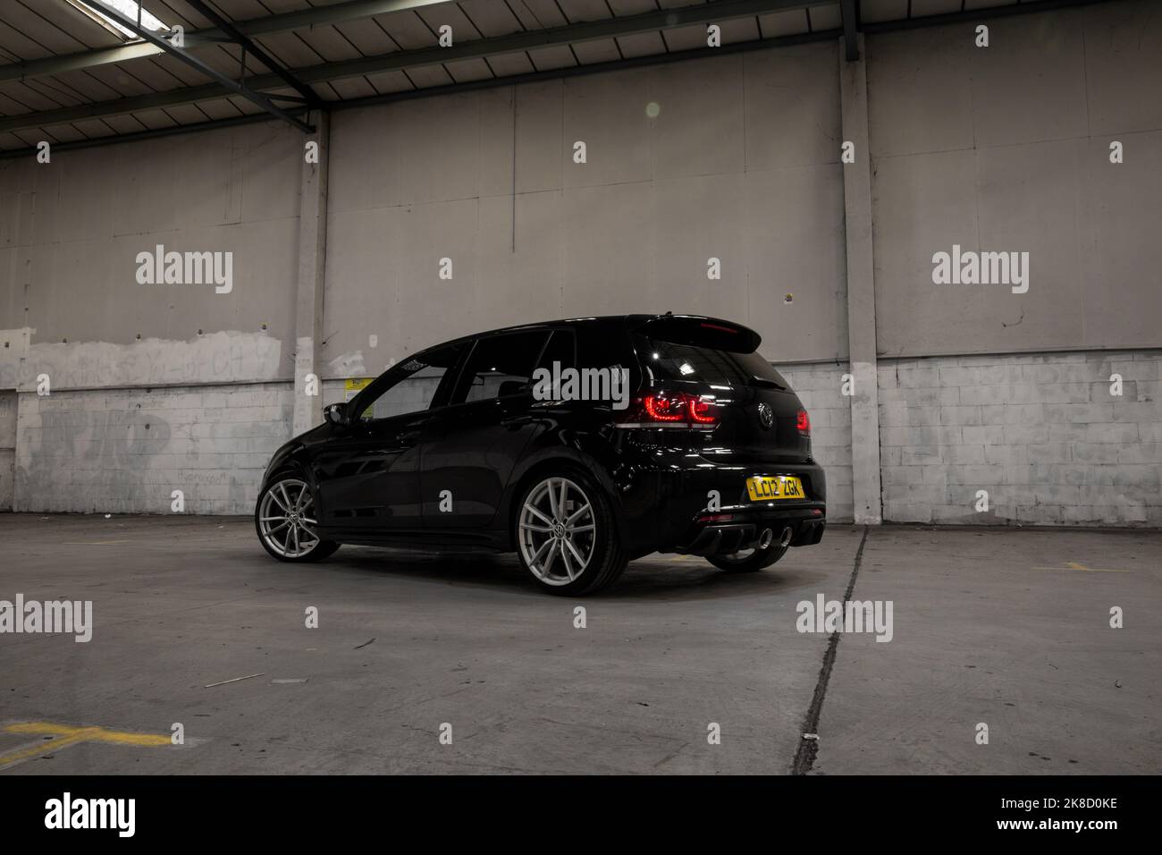 A Modified Indium Deep Black Pearl 2012 Volkswagen Golf R MK6 Hatchback With Silver Alloy Wheels With Carbon Fibre Aftermarket Bodykit Stock Photo