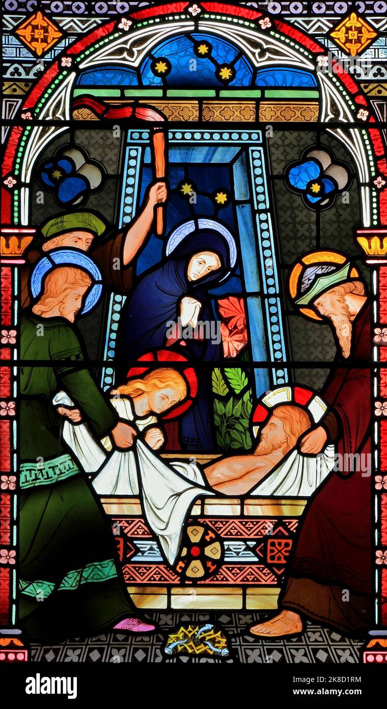 Joseph of Arimathea, Nicodemus, lay Jesus' body in tomb, passion, stained glass, window Stock Photo