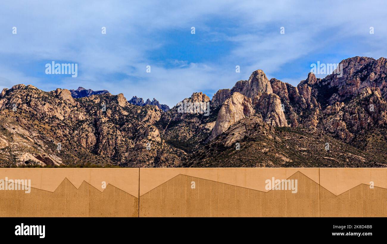A decorative roadside wall mimics the outline of Pusch Ridge near Tucson, Arizona. Stock Photo