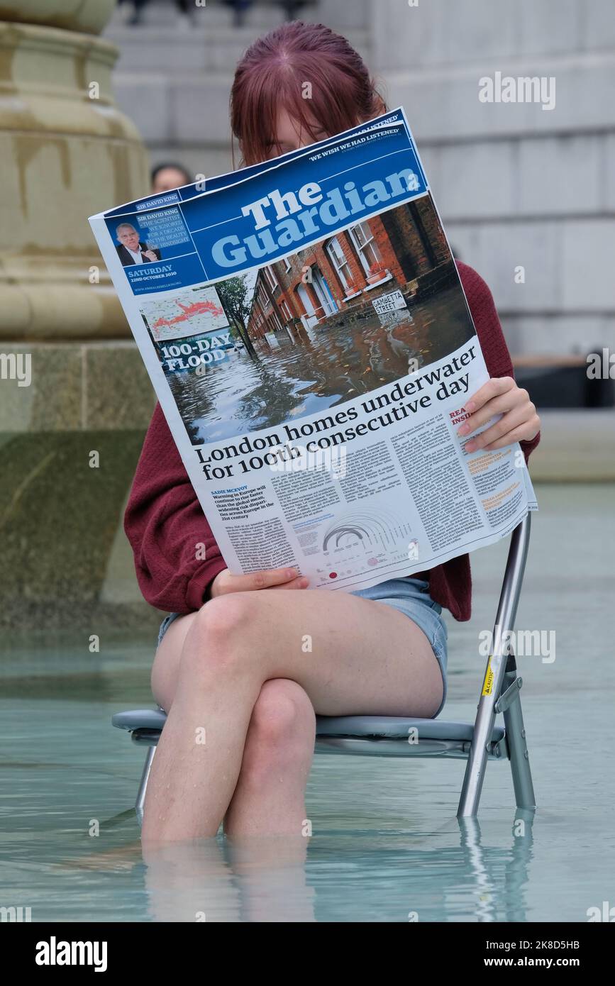 London, UK, 22nd October, 2022. Animal Rebellion activists stage a demonstration in the Trafalgar Square fountain with a mock Guardian newspaper and tofu, following comments made by former Home Secretary Suella Braverman criticising protesters. The group urges government action to transition from animal farming towards a plant-based food system. Credit: Eleventh Hour Photography/Alamy Live News Stock Photo