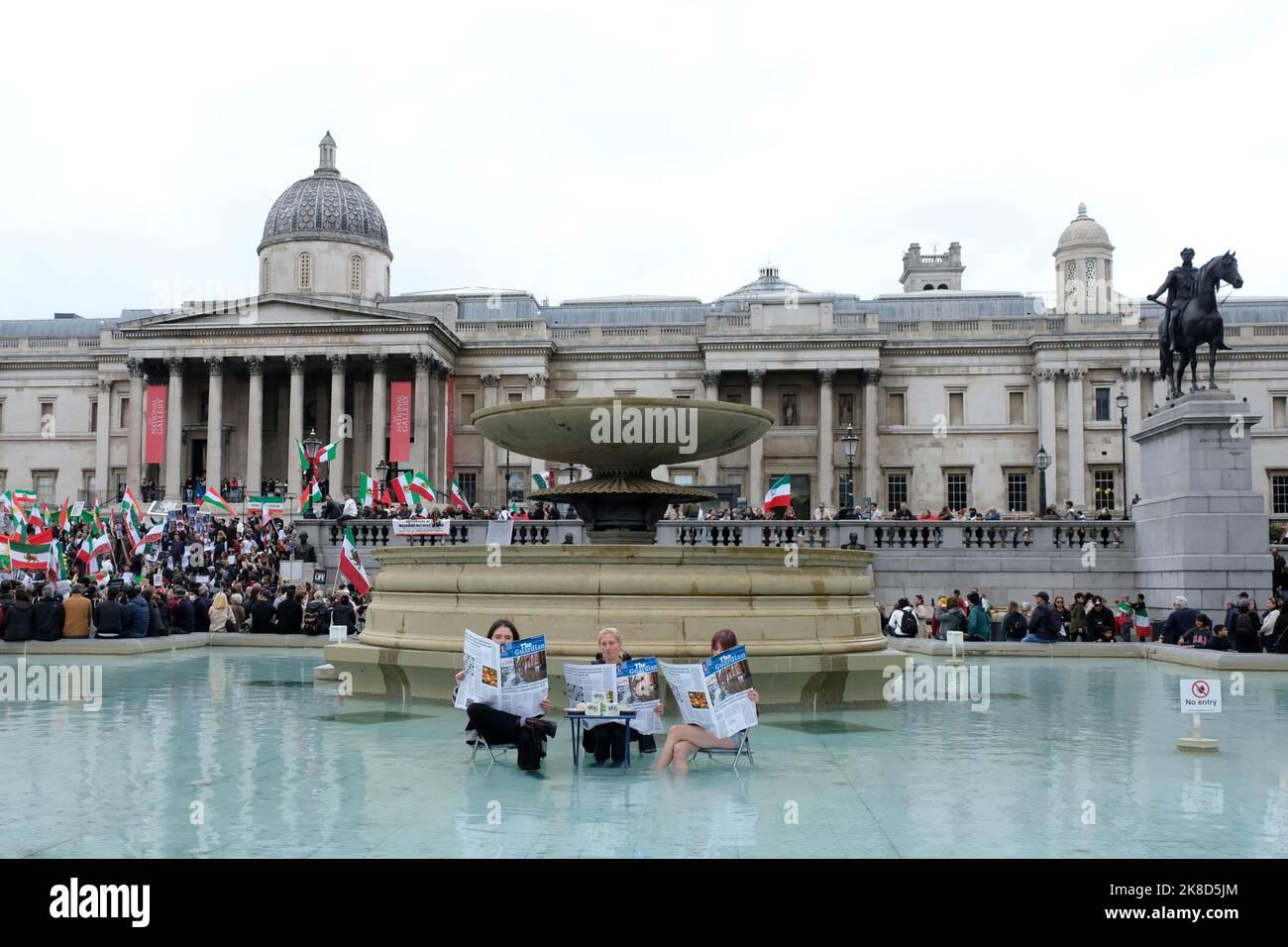 London, UK, 22nd October, 2022. Animal Rebellion activists stage a demonstration in the Trafalgar Square fountain with a mock Guardian newspaper and tofu, following comments made by former Home Secretary Suella Braverman criticising protesters. The group urges government action to transition from animal farming towards a plant-based food system. Credit: Eleventh Hour Photography/Alamy Live News Stock Photo