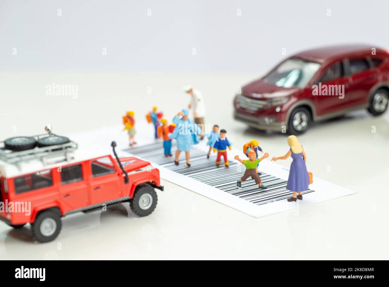 Miniature toys school kids walk on cross road bar code school