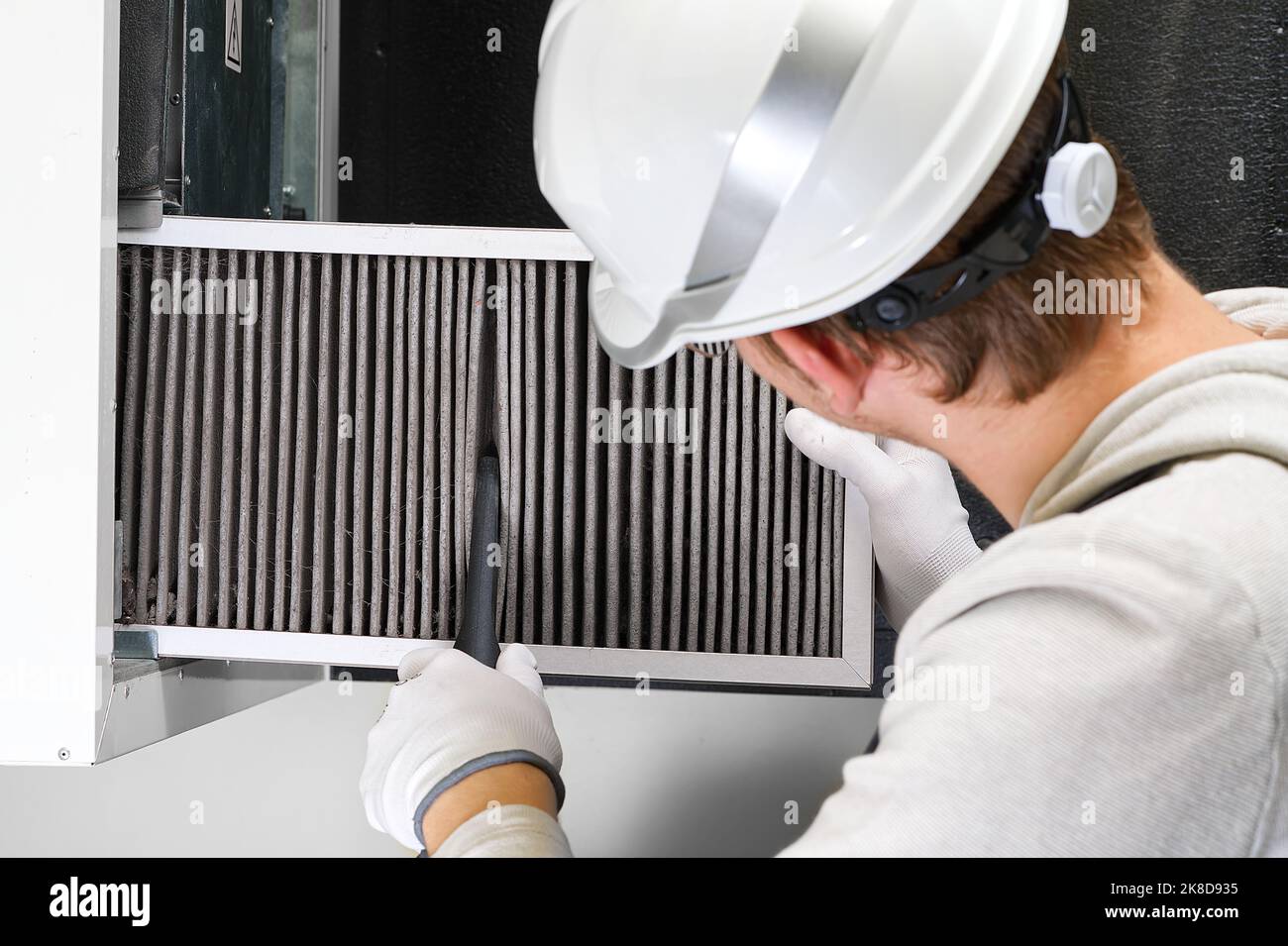 Replacing filter in the central ventilation system. hvac filter