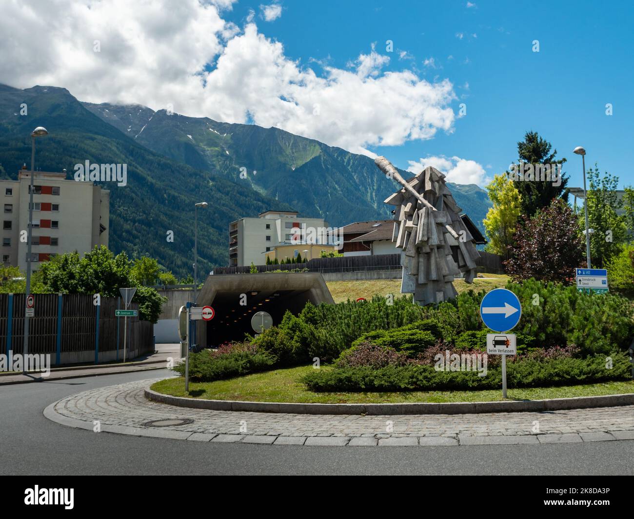 Sculpture 'Der Wilde' (the Savage) on a roundabout. Austrian culture in Tirol. The statue is a figure of the Telfer Schleicher running of the event. Stock Photo