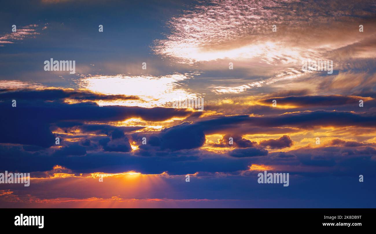sunset on cloudy sky at blue hour Stock Photo