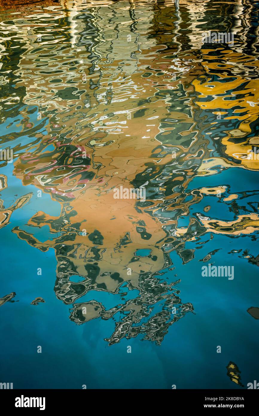 Reflections in the water of a Venetian canal Stock Photo - Alamy