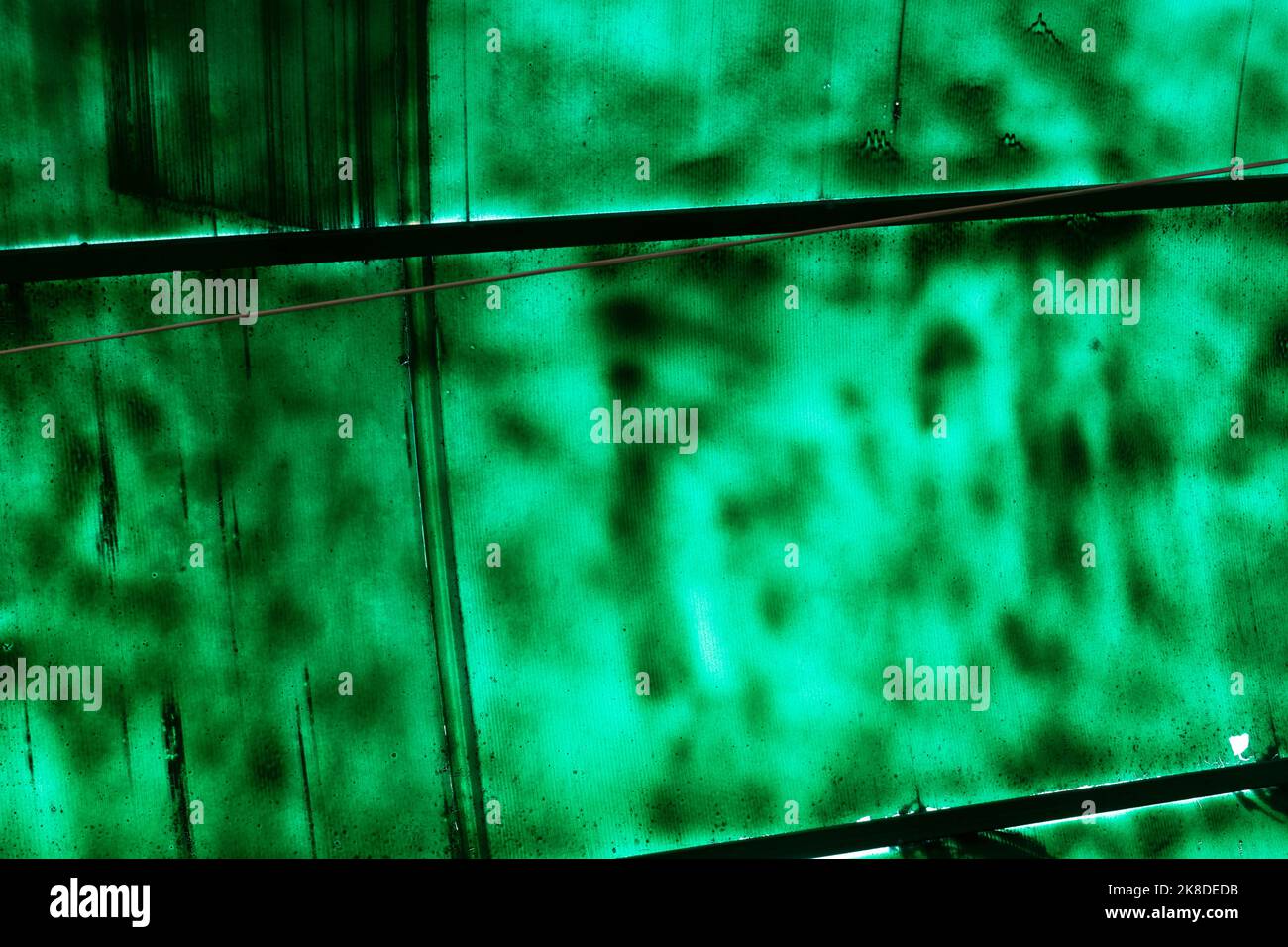 Green roof is not evenly painted. Green spots on plastic roof