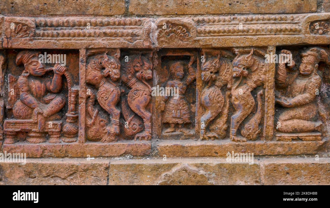 Detail of man with hookah and mythological creatures : terracotta carving at Kantaji aka Kantajew hindu temple in Kantanagar, Dinajpur, Bangladesh Stock Photo