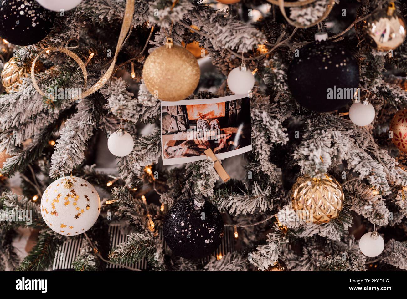 Christmas tree decorated with photos and garlands Stock Photo - Alamy