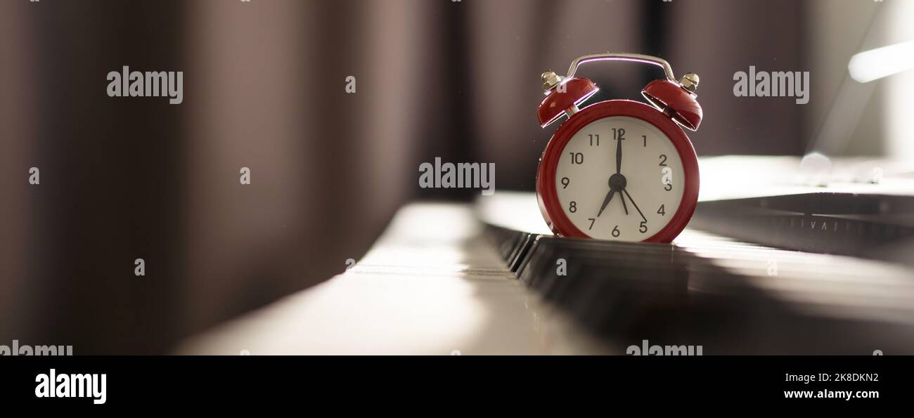 alarm clock on piano, synthesizer Stock Photo