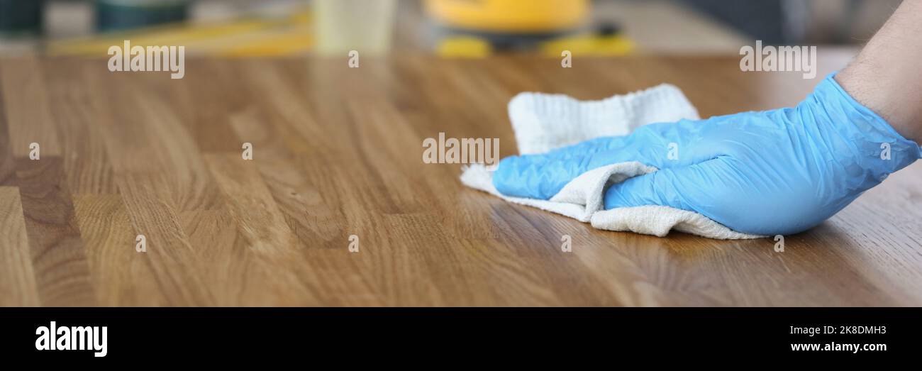 Woman hands apply homemade beeswax wood treatment polish to restore natural  wood bowl color. Beeswax, olive oil and essential oil, soft cloth Stock  Photo - Alamy