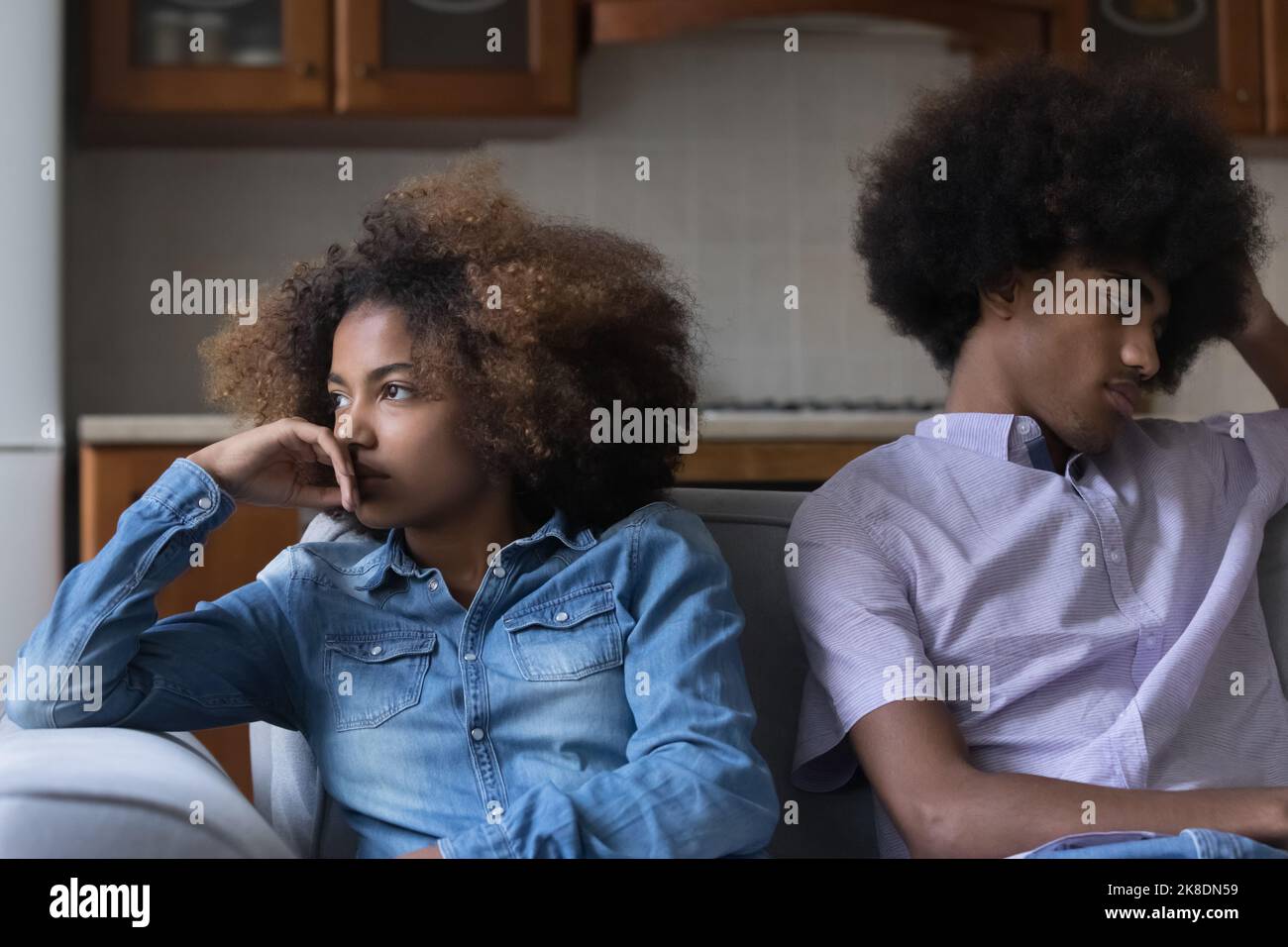 Sad African couple sit on sofa feel upset after quarrel Stock Photo - Alamy