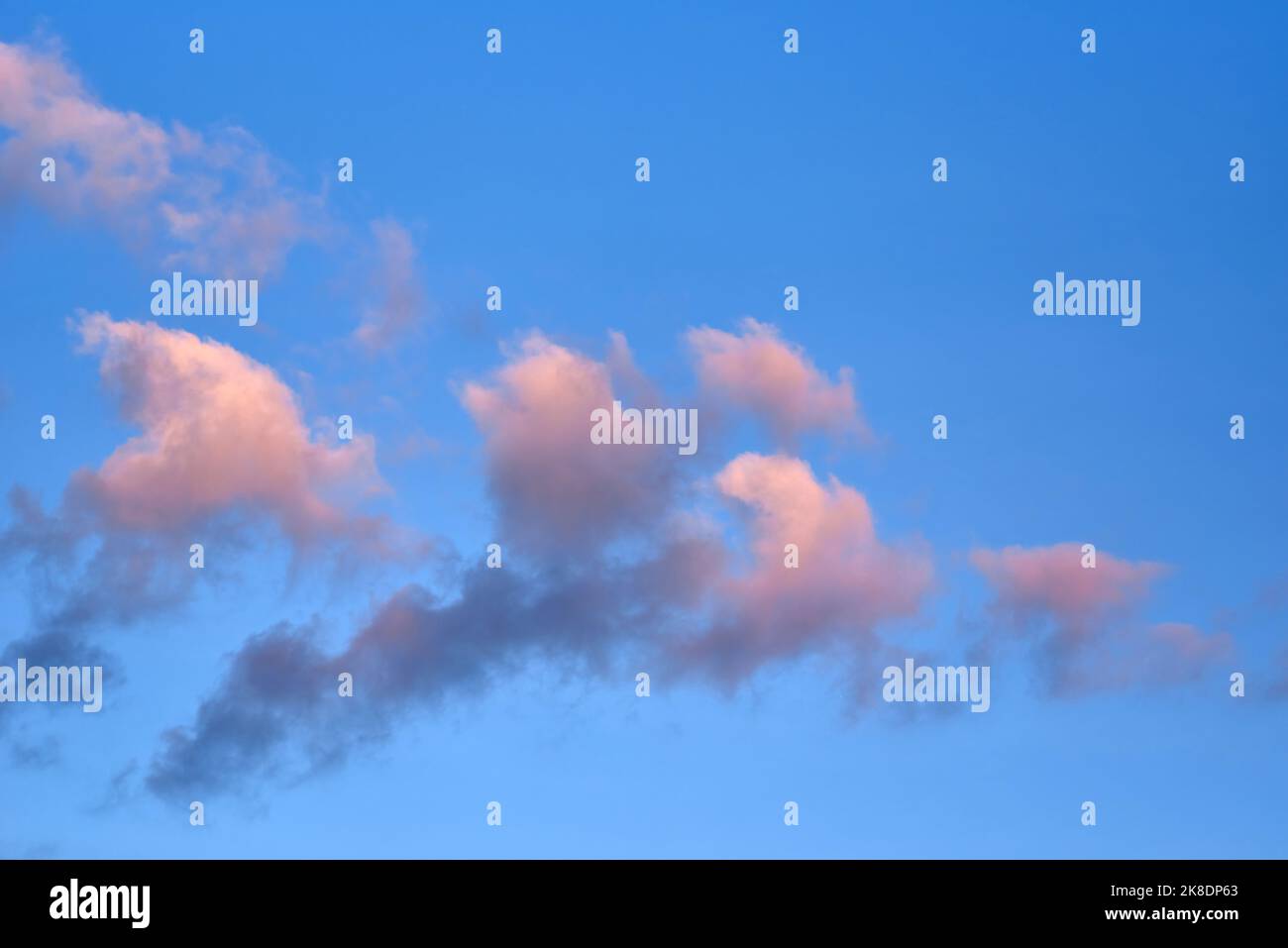 Fluffy clouds with colorful light in the evening Stock Photo